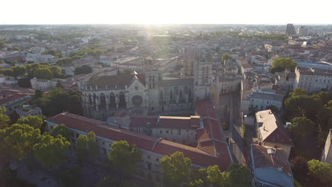 Aerial-view-flying-towards-Montpellier-cathedral-during-sunrise.-France